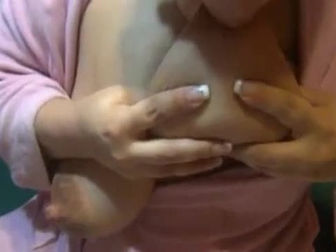 Lactating mom pink bathrobe sucks on her huge milky tits